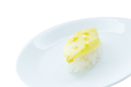 Mango sticky rice sushi dessert on white plate and white backgroundの写真素材
