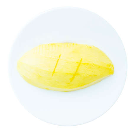 Sweet ripe Mango tropical fruit on top view and white backgroundの写真素材