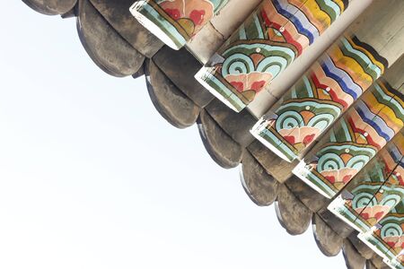 Gyeongbokgung roof edge detail with colorful painting historic architecture in Korea