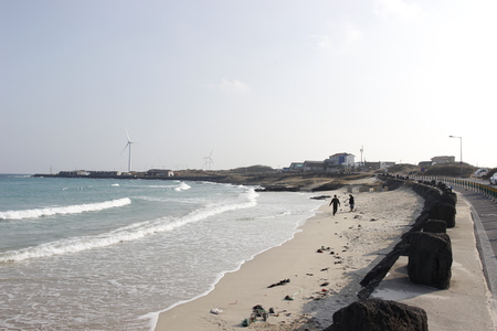 Beach with along stone block and turbine nature backgroundのeditorial素材