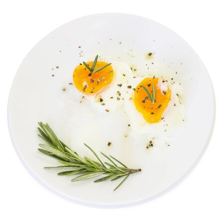 Breakfast  boiled egg yolk on white plate and white backgroundの写真素材