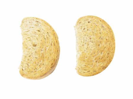 Half circle shape whole wheat toast top view on white backgroundの写真素材