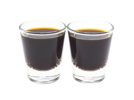 Coffee espresso in glass shot on white backgroundの写真素材