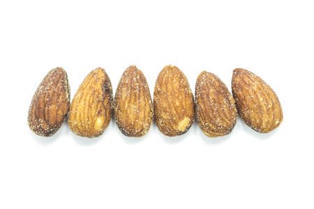 Dried brown Almonds protein snack on white backgroundの写真素材