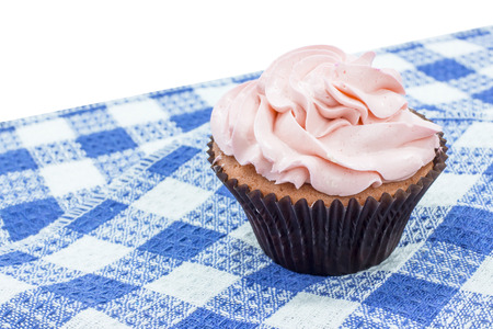Strawberry Cup cake with rose arts on table mat and white backgroundの写真素材