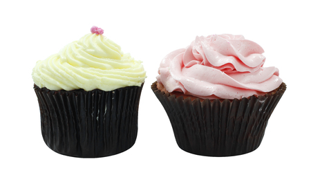 Vanilla and strawberry cup cake side view on white backgroundの写真素材