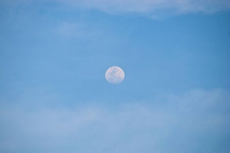 Moon in the blue skyの写真素材