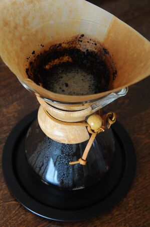 Coffee is brewing in filter close up