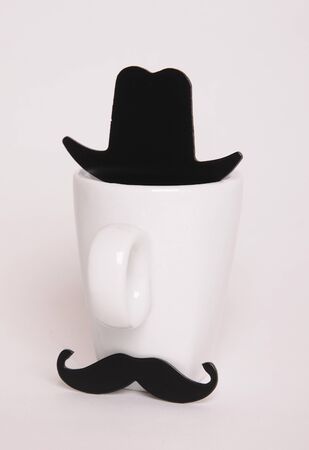 White coffee cup like a man on white background. Hipster style, mustache, hatの写真素材