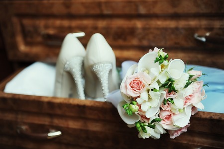 Bridal bouquet and wedding shoesの写真素材