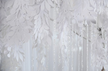Textile background closeup. White drapery fabric flowers. Wedding texture, lace and beadsの写真素材
