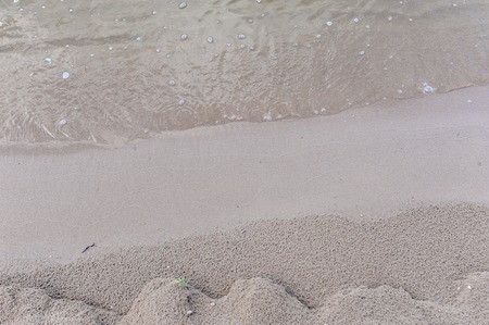Texture of wet coastal sandの写真素材
