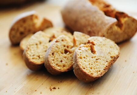 Sliced white yeast-free curd wheat bread on wooden bamboo board