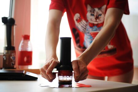 Home brewing coffee in a compact manual espresso maker
