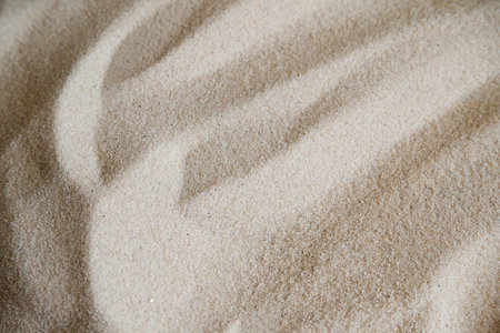 Wavy fine sand texture. Natural background