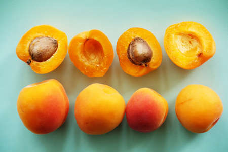 Apricots on a soft blue green background, close-upの写真素材