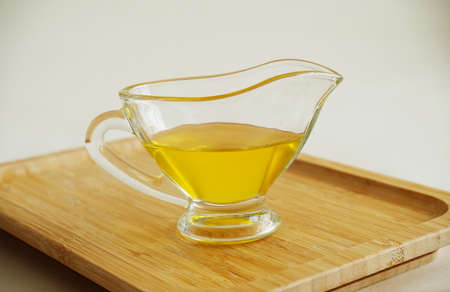 Freshly made liquid homemade ghee butter oil. Healthy food concept. Ayurveda traditional productの写真素材