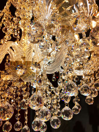 Beautiful twinkle crystal chandelier, warm light, close upの写真素材
