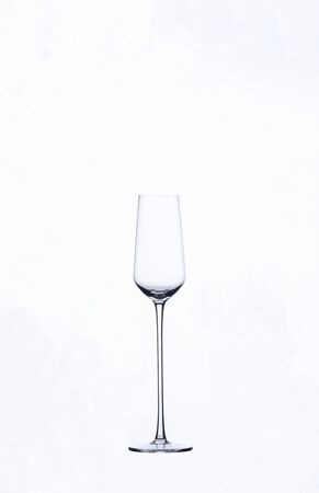 beautiful elegant champagne glass on a white backgroundの写真素材