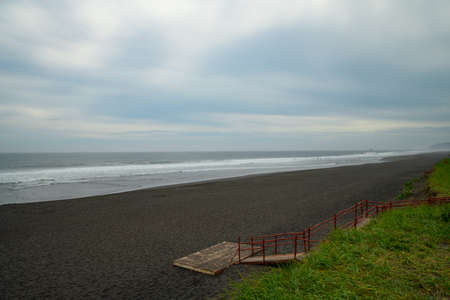 Landscape. A huge, many kilometers long sandy beach with black volcanic sand.の写真素材