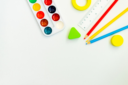 watercolor paints and stationery on white backgroundの写真素材