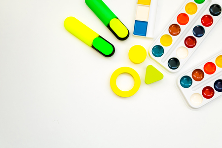 watercolor paints and stationery on white backgroundの写真素材