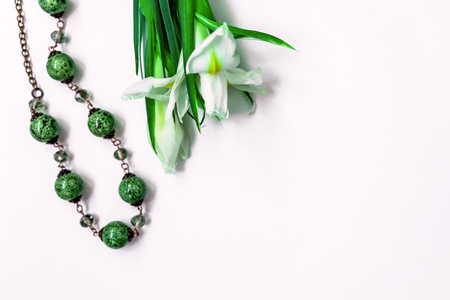 daffodils and beads green on white backgroundの写真素材