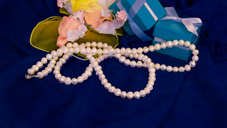 jewelry on blue fabric background
