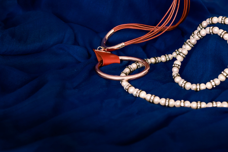 jewelry on blue fabric backgroundの写真素材