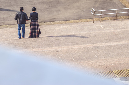 people walking along the promenadeの写真素材