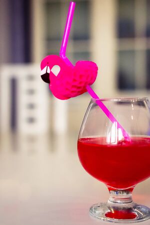 drink red with decorative drinking tube decorated with Flamingo figureの写真素材
