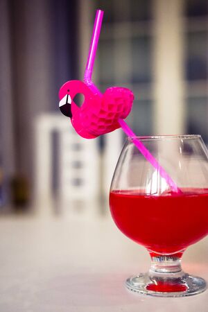 drink red with decorative drinking tube decorated with Flamingo figureの写真素材