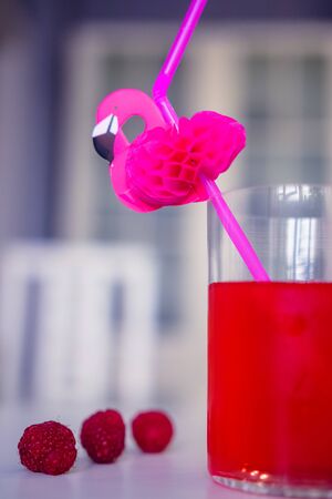 drink red with decorative drinking tube decorated with Flamingo figureの写真素材