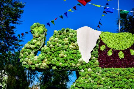 fragment of a figure of elephant made of flowers to decorate the streets during the festival