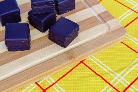 Austrian honey cakes on a wooden Board and yellow textiles