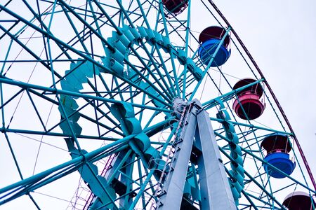 the attraction, ride wheel display in the city park in cloudy weatherの写真素材