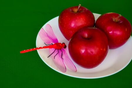 red apples on a white plateの写真素材