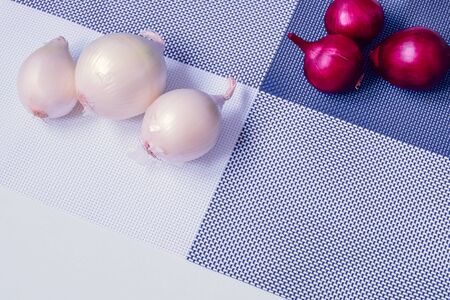 red onion and white onion on a background divided into four partsの写真素材