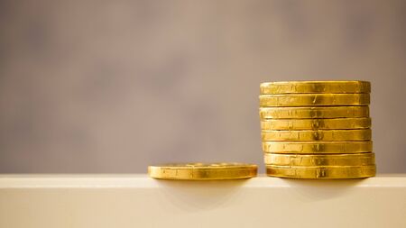 fake money - chocolate in the form of coins covered with Golden foilの写真素材