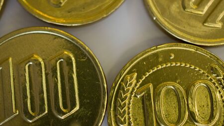 fake money - chocolate in the form of coins covered with Golden foilの写真素材