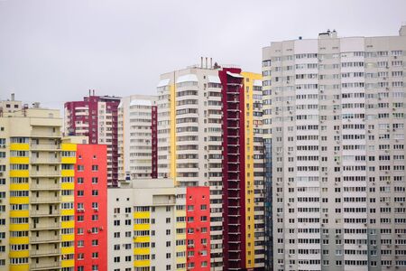 multi-storey houses with bright rskraskoy on a cloudy dayの写真素材