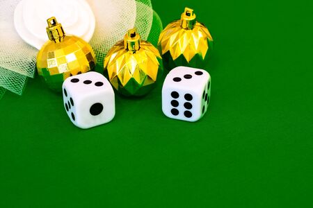 white dice on green cloth or tableclothの写真素材