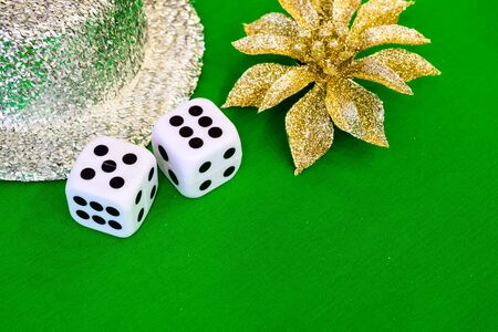 white dice on green cloth or tableclothの写真素材