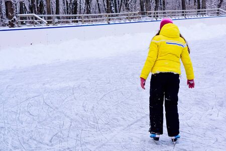 skating people on a skating rink in a snow park