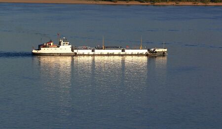 river passenger or cargo ship in summer dayの写真素材