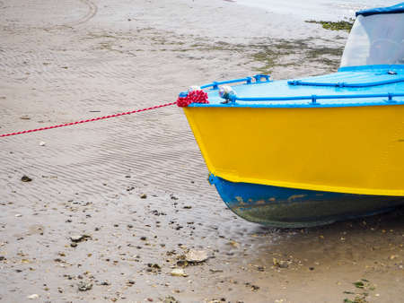 boat or motor boat and rigging in summer on a sandy beach on a Sunny dayの写真素材