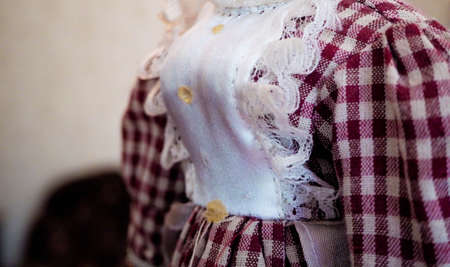 fragment of a dress for a porcelain dollの写真素材