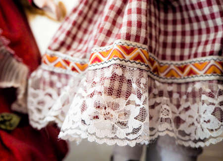 fragment of a dress for a porcelain dollの写真素材