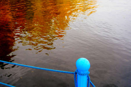 autumn landscape next to a river or lake, cloudy dayの写真素材