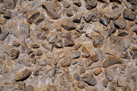 stones, rubble in a concrete wall